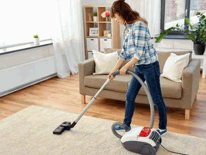 vacuuming the rugs